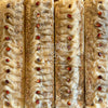 Close-up of a sandalwood bar with a textured surface and visible brand name 'Cedarwood'.