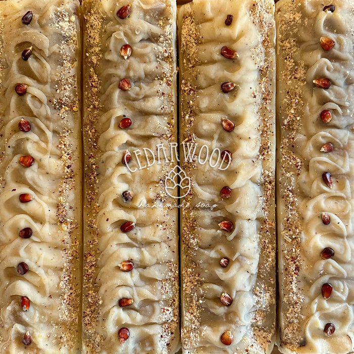 Close-up of a sandalwood bar with a textured surface and visible brand name 'Cedarwood'.