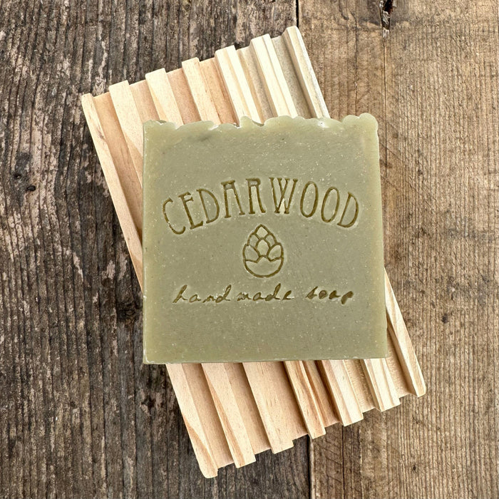 Balsam fir and mint handmade soap on wood soap dish
