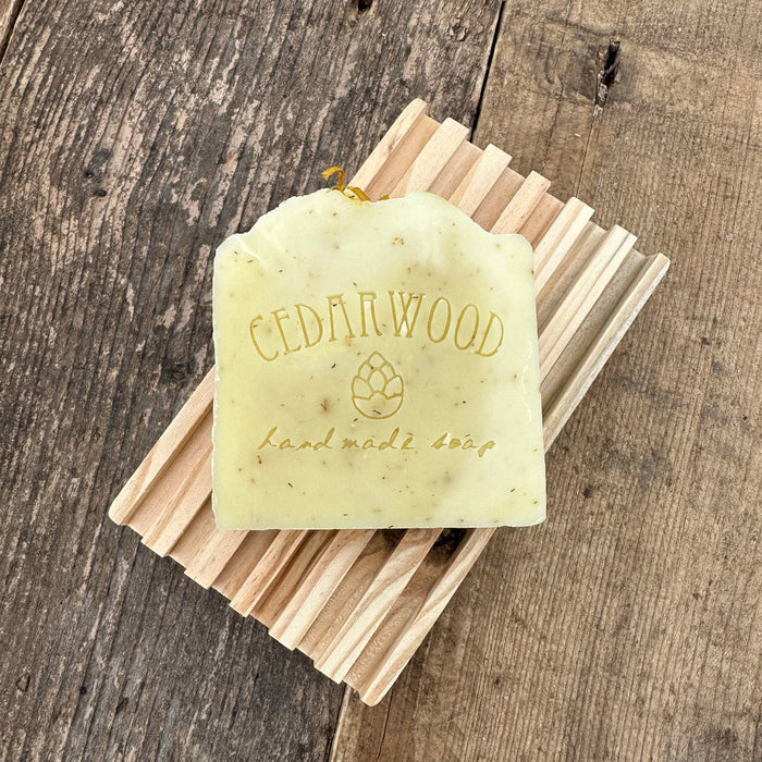 Calendula chamomile handmade soap on wood soap dish