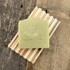 Cedarwood Oatmeal handmade soap bar on wood soap dish 
