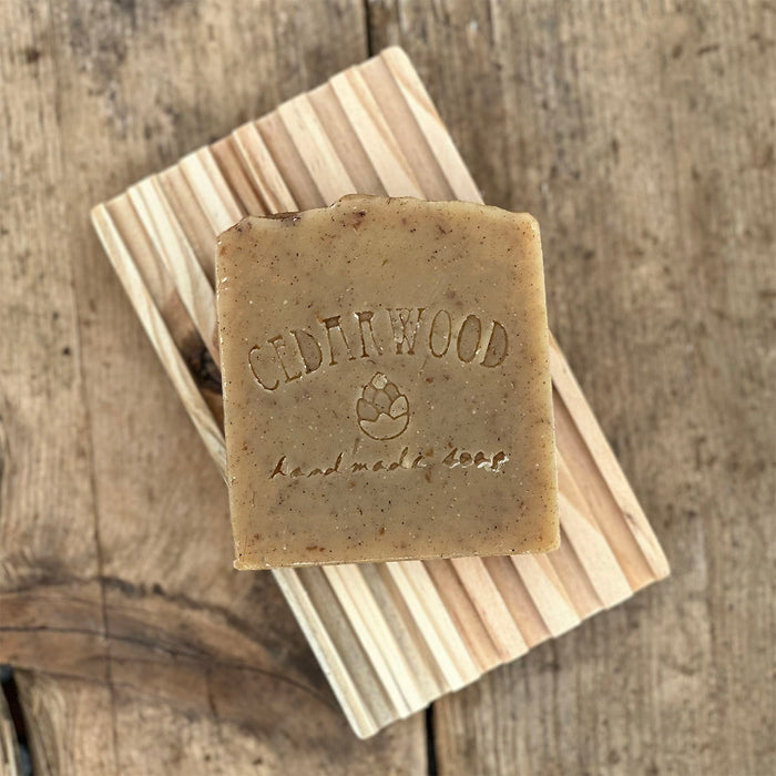 Cinnamon Oatmeal handmade soap bar on wood soap dish 