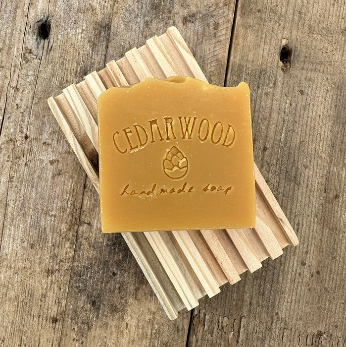 Lemongrass IPA handmade soap bar on wood soap dish 