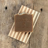 Milk chocolate mint handmade soap bar on wood soap dish