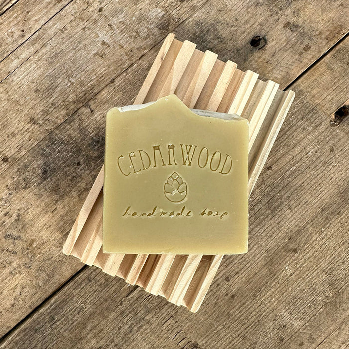 Patchouli handmade soap bar on wood soap dish