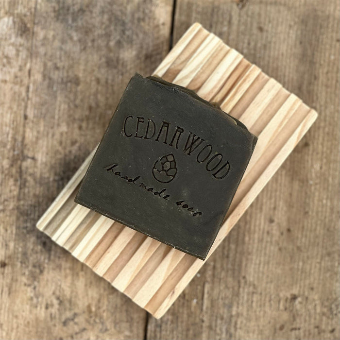 Pine tar handmade soap on wood soap dish