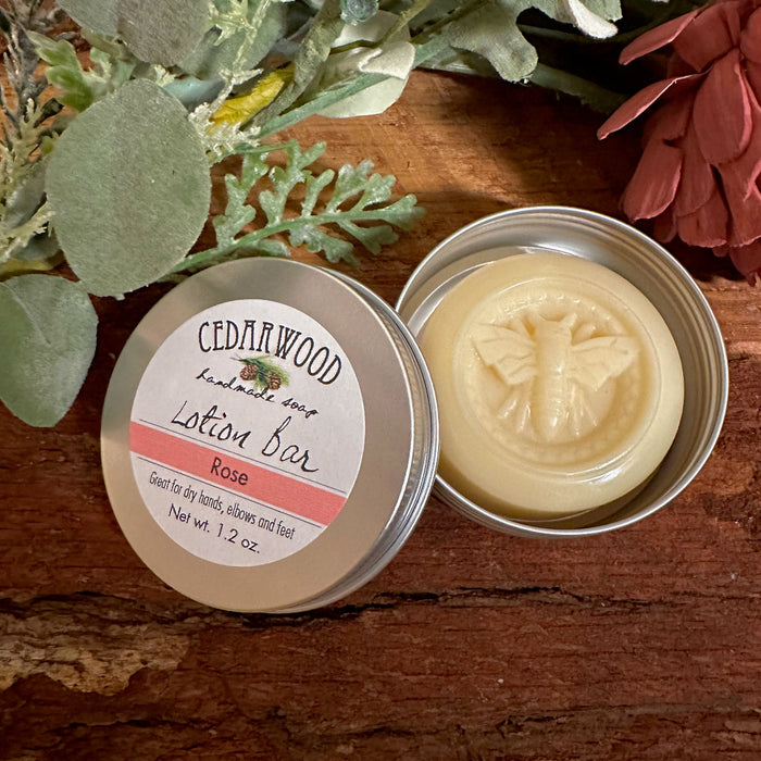 Rose-scented lotion bar with bee imprint design in aluminum tin