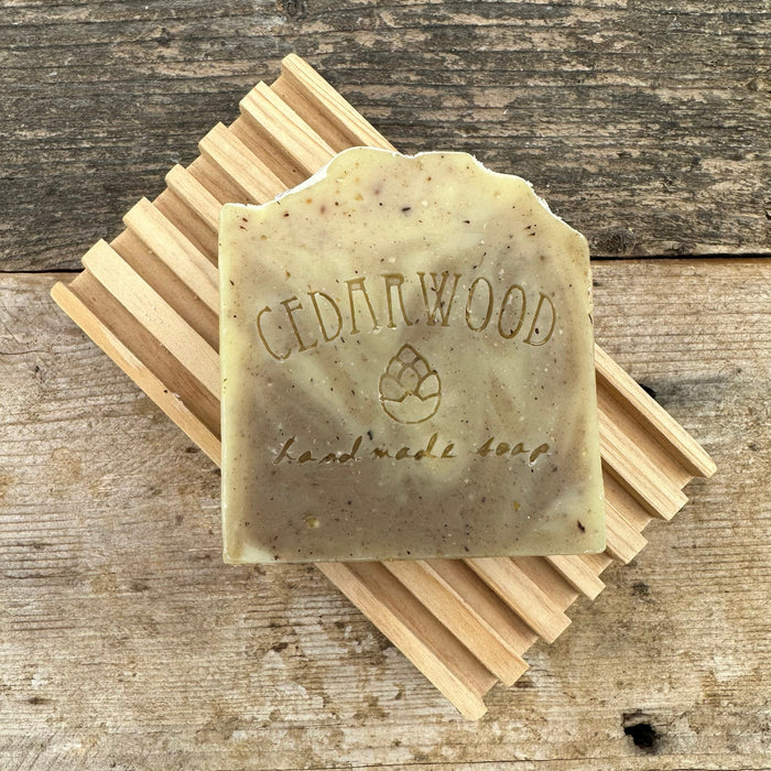 Sandalwood handmade soap bar on wood soap dish