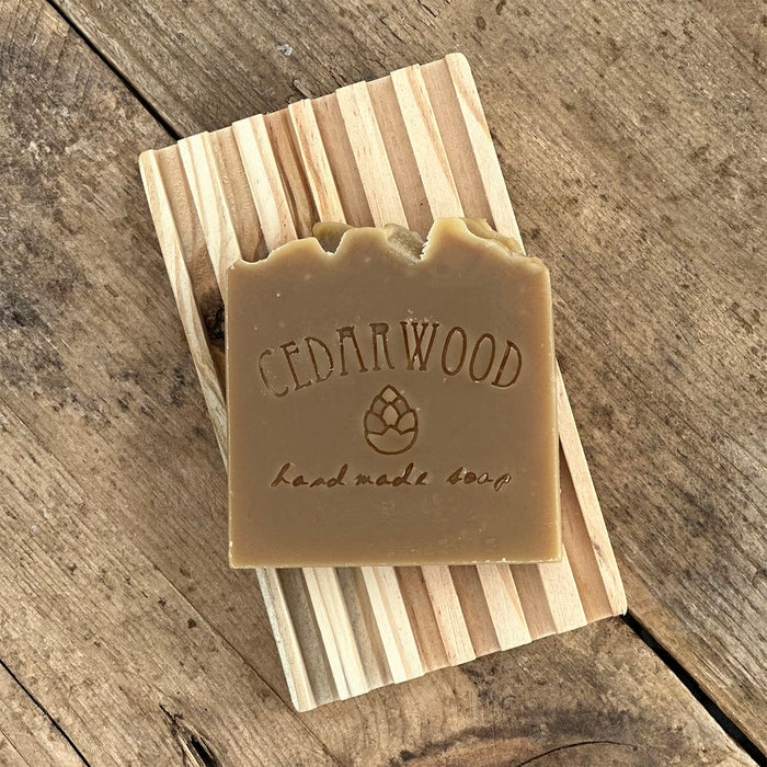 Shampoo beer handmade soap on wood soap dish